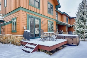 A wooden house with a patio area, outdoor seating, and a hot tub. - Family Hot Tub, MountainScape Chalet! Paradise! (Breckenridge)