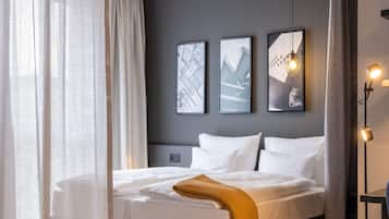 Hypo-allergenic bedding, desk, laptop workspace, blackout curtains