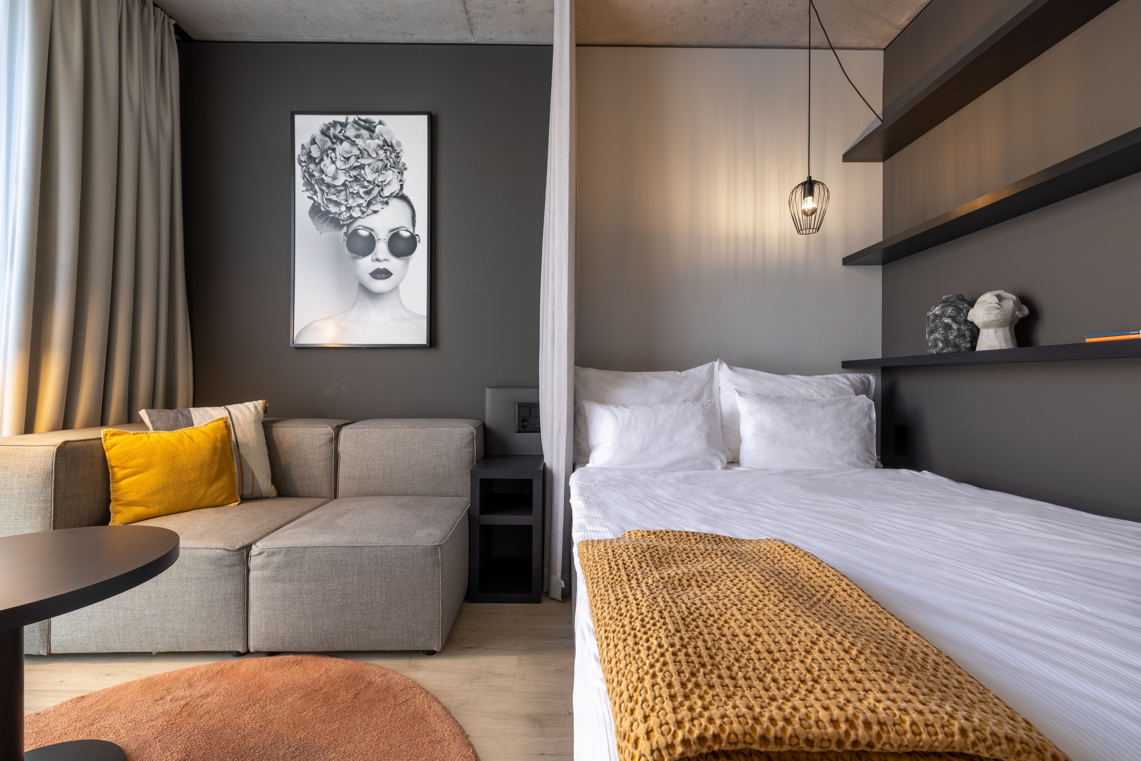 Hypo-allergenic bedding, desk, laptop workspace, blackout drapes