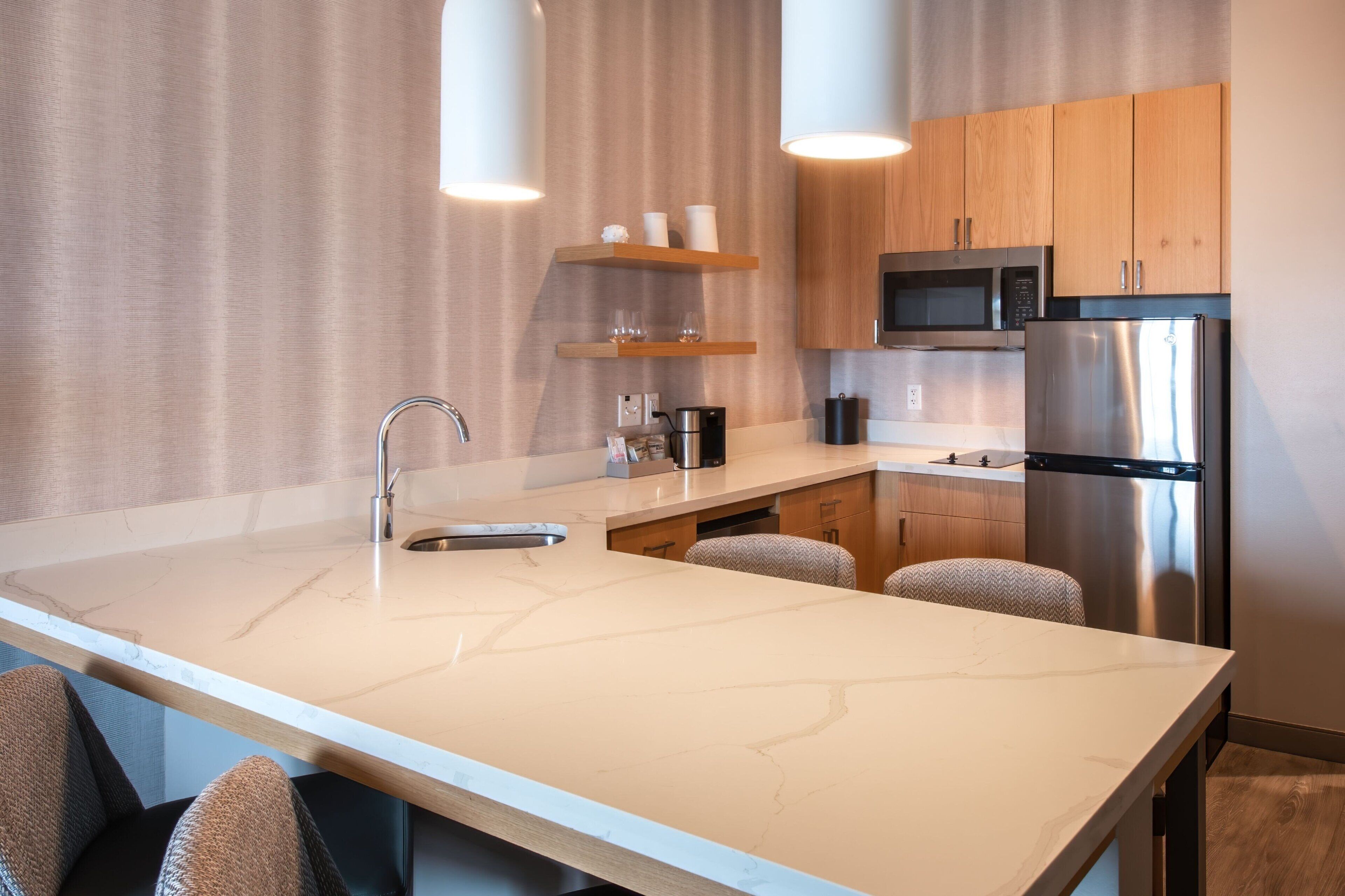 full-sized fridge, microwave, stovetop, dishwasher