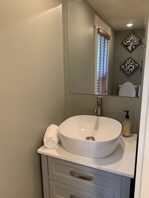 Combined shower/tub, hair dryer, towels, toilet paper