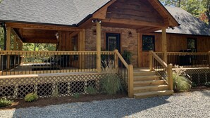 A log cabin with a covered porch, stone foundation, and a gravel driveway. - BUDDHA BLUE RIDGE TREES is a BRAND NEW custom 4/4 Close to town Find your ZEN... (Blue Ridge)