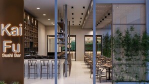 A modern interior of a sushi bar with a bar area, seating, and a staircase. - Atlantica Sea Breeze - Adults Only (Paralimni)