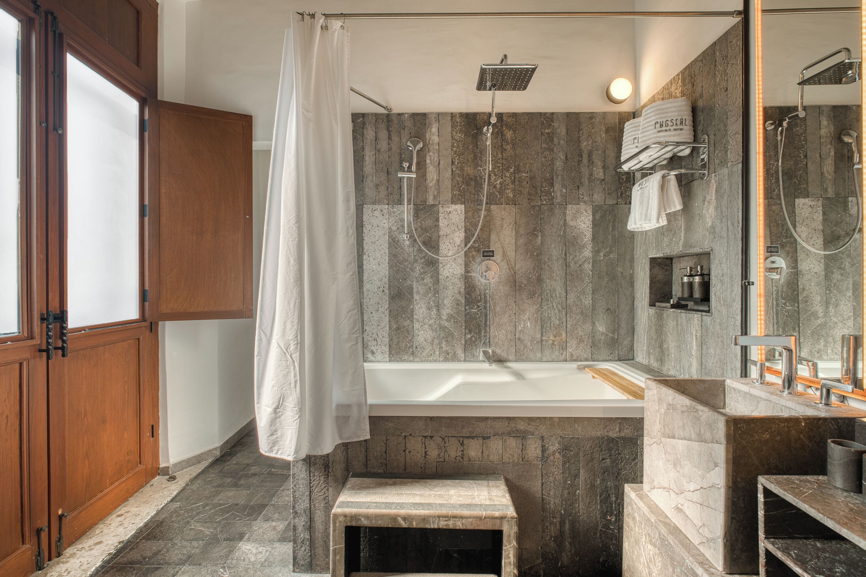 master suite / bathtub | bathroom | shower, rainfall showerhead, free toiletries, hair dryer