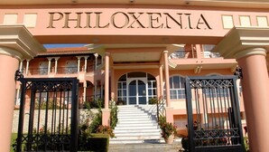 The entrance to a building with the name PHILOXENIA prominently displayed above the entrance. - Philoxenia Hotel (Corfu)