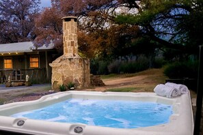 Outdoor spa tub - Cabin on secluded wildlife ranch. Hot tub. Dark skies. 1/2 mile river frontage. (Lometa)
