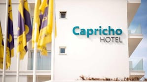 A hotel sign with the name "Capricho Hotel". - Hotel Capricho (Capdepera)
