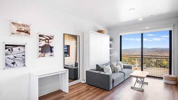 Studio Deluxe | Living area | 55-inch Smart TV with cable channels, TV, Netflix