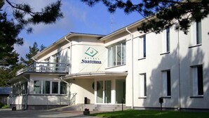 A modern hotel with a white facade, a balcony, and a logo that reads "Hotel Saaremaa." - Saarema Thalasso Spa Hotel (Mandjala)