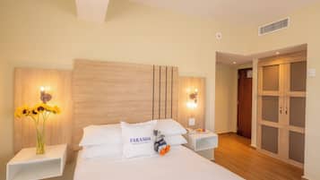 Premium bedding, down comforters, minibar, in-room safe