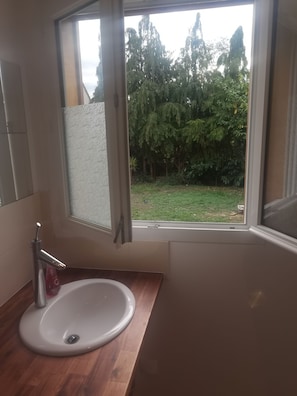 Shower, hair dryer, towels, toilet paper