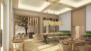 A modern dining area with a high ceiling, hanging chandeliers, and a large dining table surrounded by chairs. - Hyatt Zilara Rose Hall - Adults Only (Montego Bay)