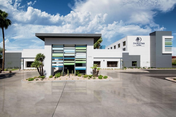 A modern building with a flat roof, a sign reading 'DOUBLETREE by Hilton,' and a number '7475' on the facade. - Doubletree by Hilton Phoenix Chandler (Chandler)