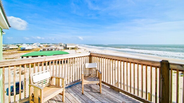A wooden deck with a view of the beach and ocean. - Wave Loudest - 103 Pushmata (Dauphin Island)