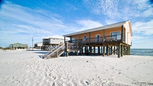 A beachfront property with a wooden deck and multiple levels. - Sun Spot - 104 Vargas Ct (Dauphin Island)