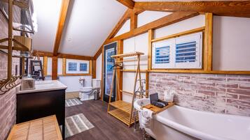 Bathtub, hair dryer, towels, toilet paper