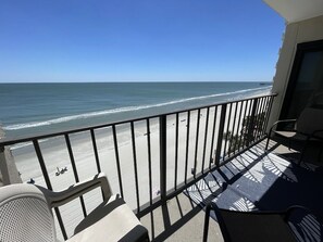 A balcony with a view of the beach and ocean. - Horizon East 704 - Oceanfront in Garden City Beach, SC (Garden City)