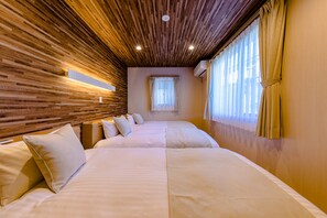 A hotel room with a wooden ceiling, two beds with white linens, a window with curtains, and an air conditioning unit on the wall. - Mt. Fuji Resort Club-ZEN- (Fujikawaguchiko)