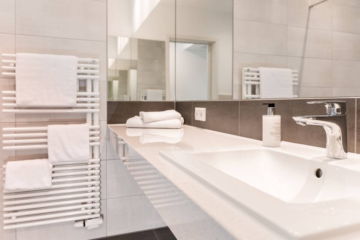 eco-friendly toiletries, hair dryer, heated floors, towels
