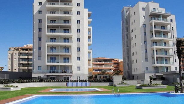A modern apartment building with a swimming pool in front. - Ground floor Aqua Nature La Mata Costa Blanca (La Mata)