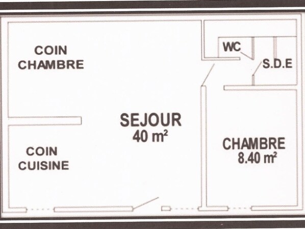 Un plano de planta que muestra una sala de monedas, una cocina para monedas, una zona de estar de 40 metros cuadrados y un dormitorio de 8,40 metros cuadrados.