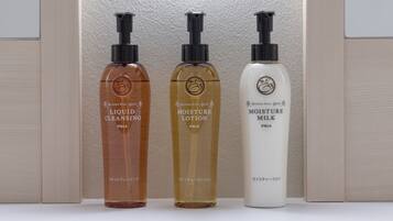 Three bottles of skincare products: liquid cleansing, moisture lotion, and moisture milk.