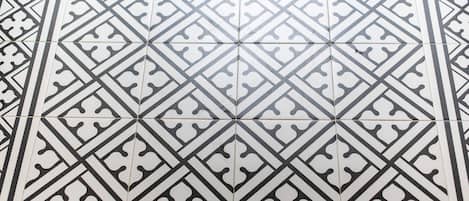 A tiled floor with a geometric pattern.