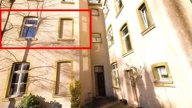 A multi-story building with multiple windows and balconies. - T1-Apartment-1.OG-HH (Bergisch Gladbach)
