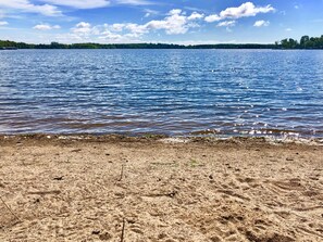 On the beach, beach towels - Large Bay Lake Lakefront Cabin w/Game Room & Water-View Deck, Dock and more… (Deerwood)