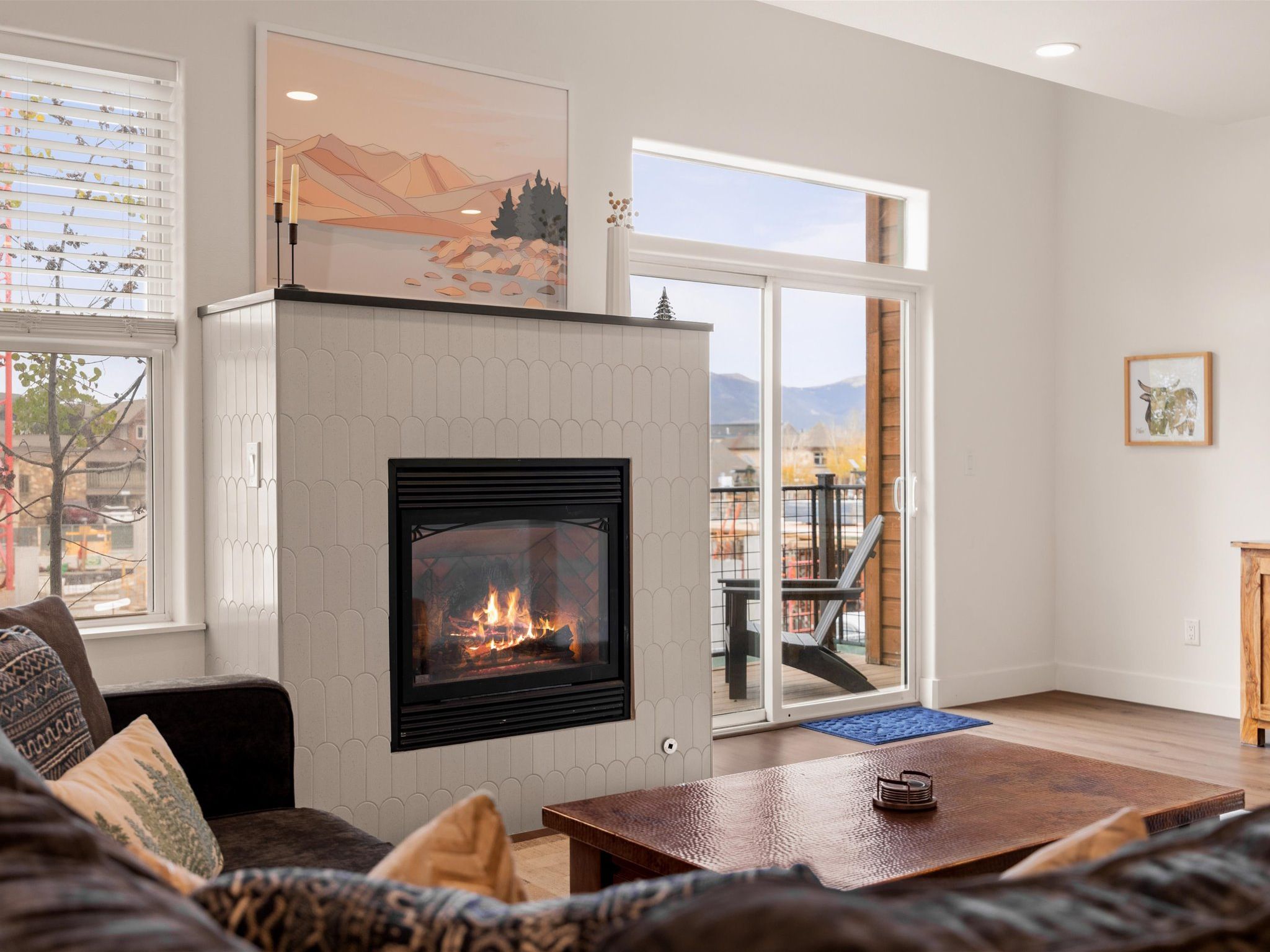 Family room with large, comfy sectional couch, huge TV (Netflix & Sling provided), and fireplace.