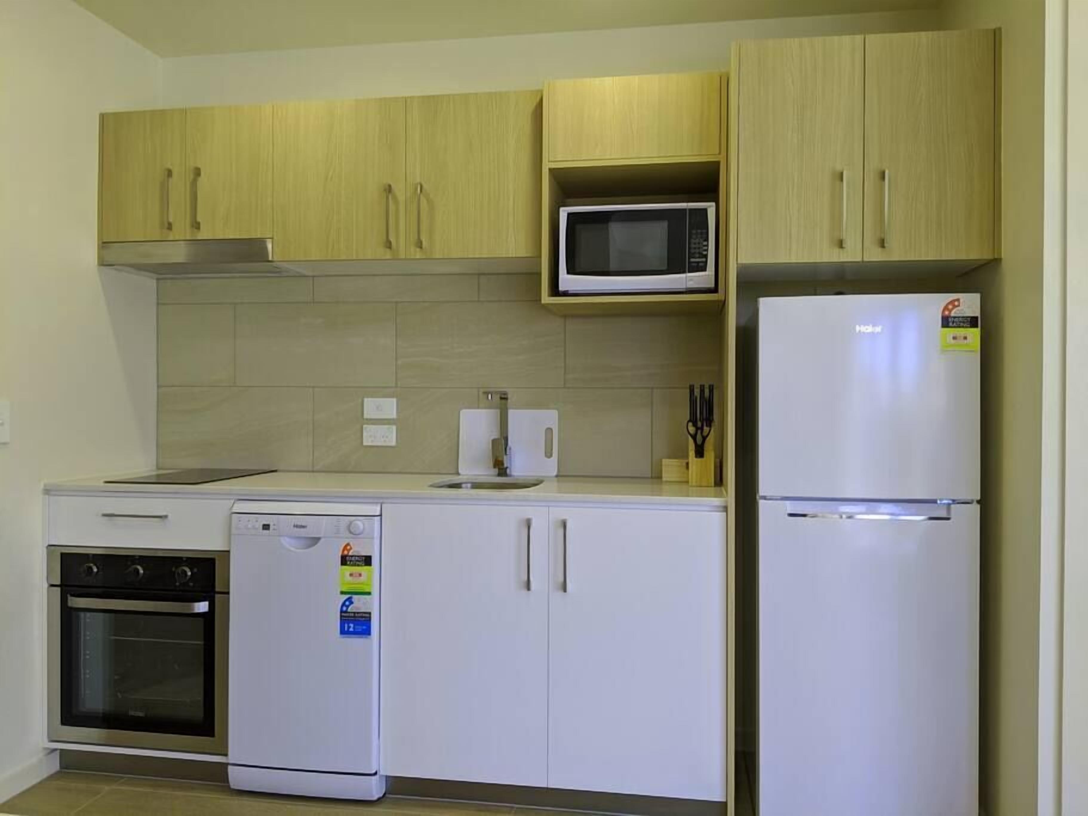 Coffee/tea maker, fridge, microwave, cookware/dishes/utensils