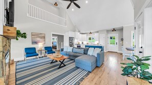 TV, fireplace - Magnolia Cove, New Lakefront Luxury w/ Covered Decks + Heated Salt Water Pool, Fire Pit & Dock! (Moneta)