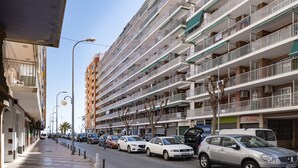 A multi-story parking garage with several cars parked on the ground floor. - LEVANTE, 6º-J (Cullera)