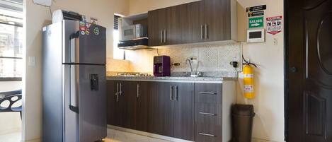 Fridge, microwave, stovetop, coffee/tea maker