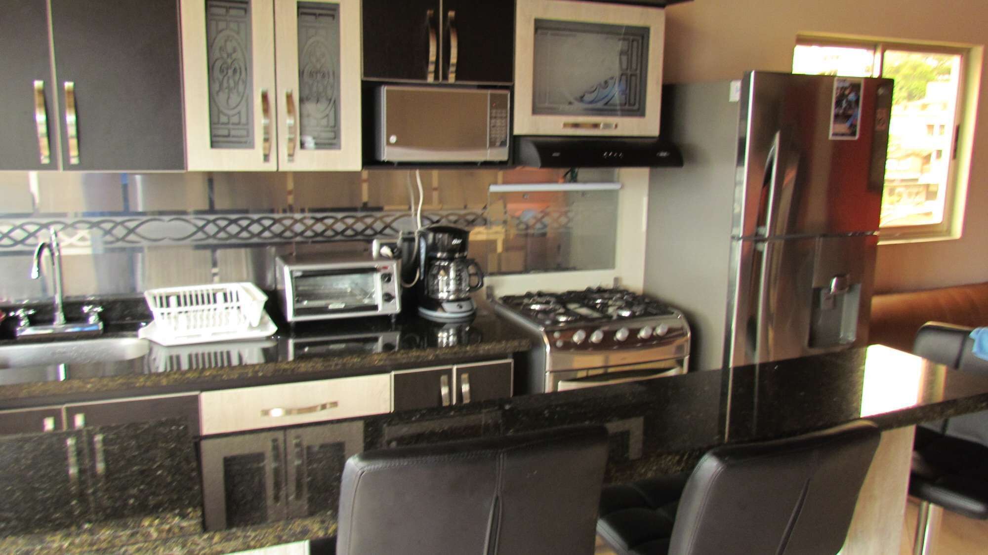 9 bedroom building 5 apartments including the roof Private AC Security 4 blocks Lleras.