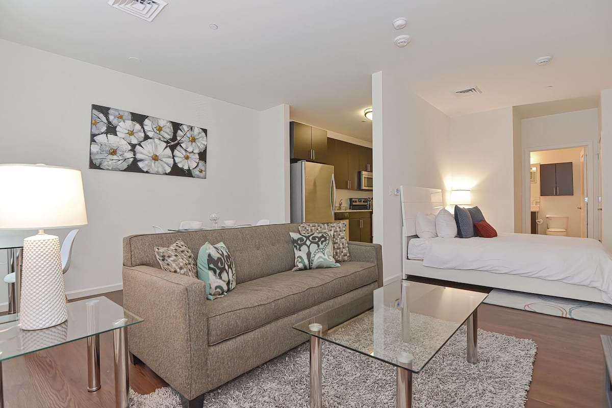 Luxury Studio, 1 Queen Bed with Sofa bed | Living room | 50-inch flat-screen TV with cable channels, TV, foosball