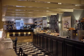 A restaurant with a checkered floor, a bar area, and a chalkboard menu. - Dikker And Thijs Fenice Hotel (Amsterdam)