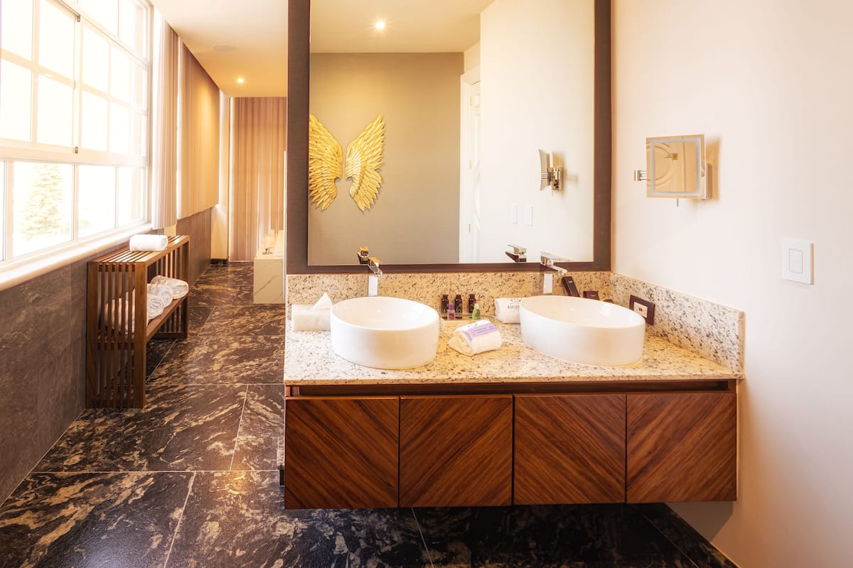 designer toiletries, hair dryer, bathrobes, slippers