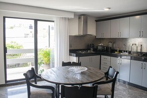 Fridge, microwave, stovetop, coffee/tea maker