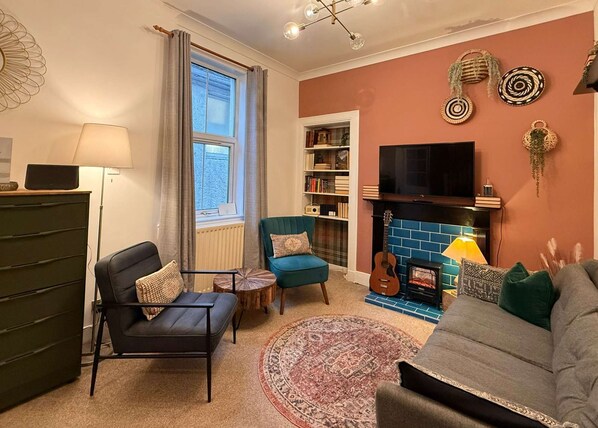 TV, fireplace, books