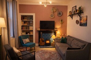 TV, fireplace, books