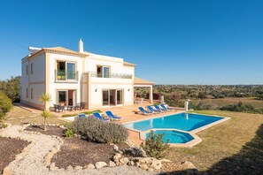 A two-story house with a swimming pool, outdoor seating, and a view of the countryside. - Villa Aguaviva -  walkable to restaurant/shop (Guia)