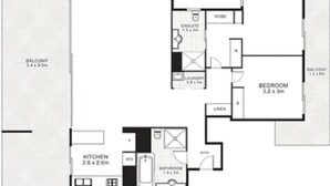 Plano de planta con balcón, cocina, baño, dormitorio y zona de lavandería.