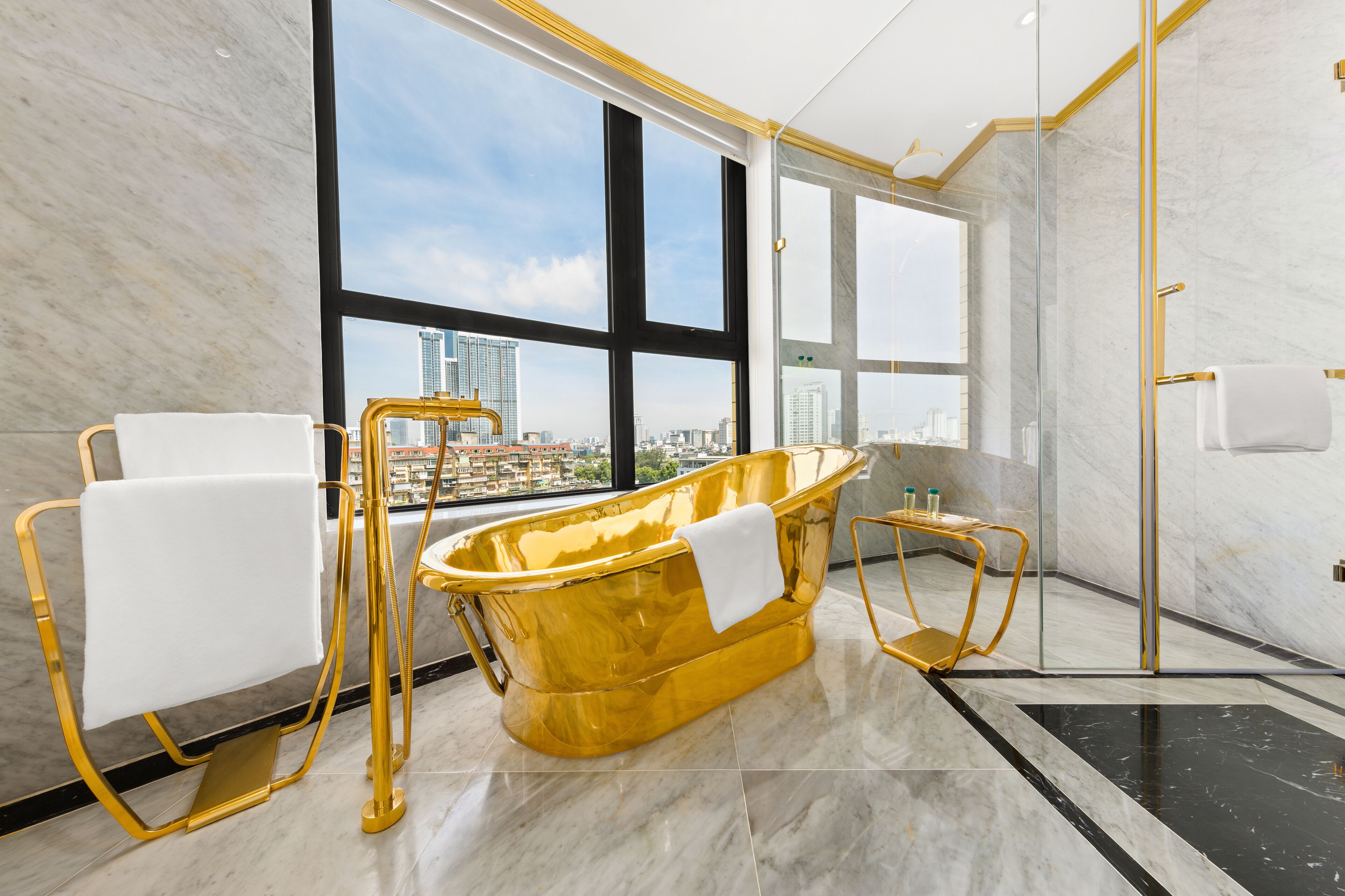 separate bathtub and shower, rainfall showerhead, designer toiletries