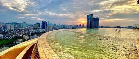 Outdoor pool, open 6:00 AM to 10:00 PM, pool umbrellas, sun loungers