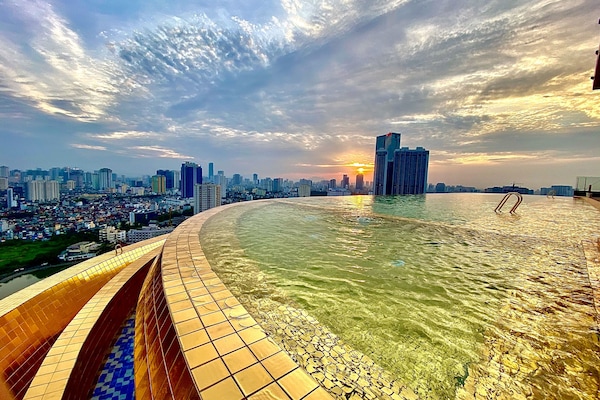 Outdoor pool, open 6:00 AM to 10:00 PM, pool umbrellas, sun loungers