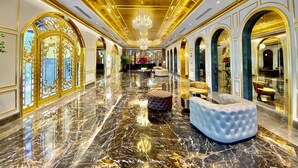 A luxurious hotel lobby with marble floors, golden accents, and elegant seating areas. - Dolce by Wyndham Hanoi Golden Lake (Hanoi)