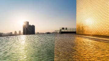 Outdoor pool, open 6:00 AM to 10:00 PM, pool umbrellas, sun loungers