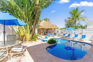 Outdoor pool, a heated pool - BEST LOCATION! NORTH END OF ANNA MARIA, FL STEPS TO BEACH & DINING - LOWER UNIT (Anna Maria)
