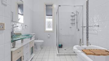 Bathtub, hair dryer, towels, soap